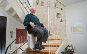 Elderly,Man,In,The,Staircase,Using,The,Stairlift