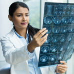 Closeup,Portrait,Of,Intellectual,Woman,Healthcare,Personnel,With,White,Labcoat,