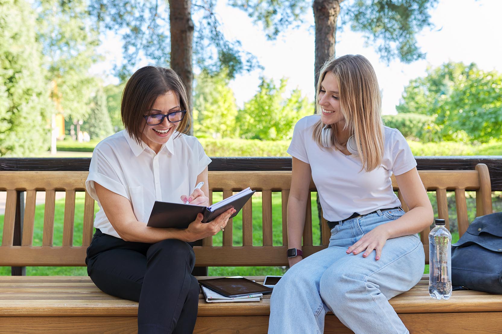 Woman,Teacher,And,Girl,Student,Teenager,Sitting,On,The,Bench